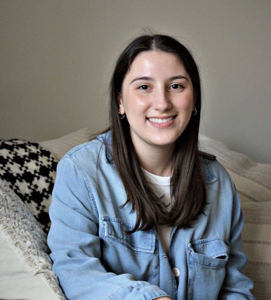 Sara Fink, smiling, seated in her office